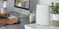 How do you initiate the Orbi setup using your mobile device?